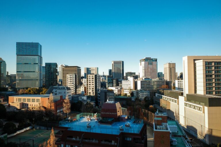 View of Chiyoda City Tokyo featuring modern skyscrapers under a clear blue sky.
